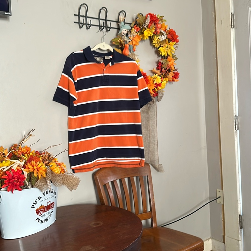 Mens Sunriver brand polo orange with large navy stripe and white small stripe